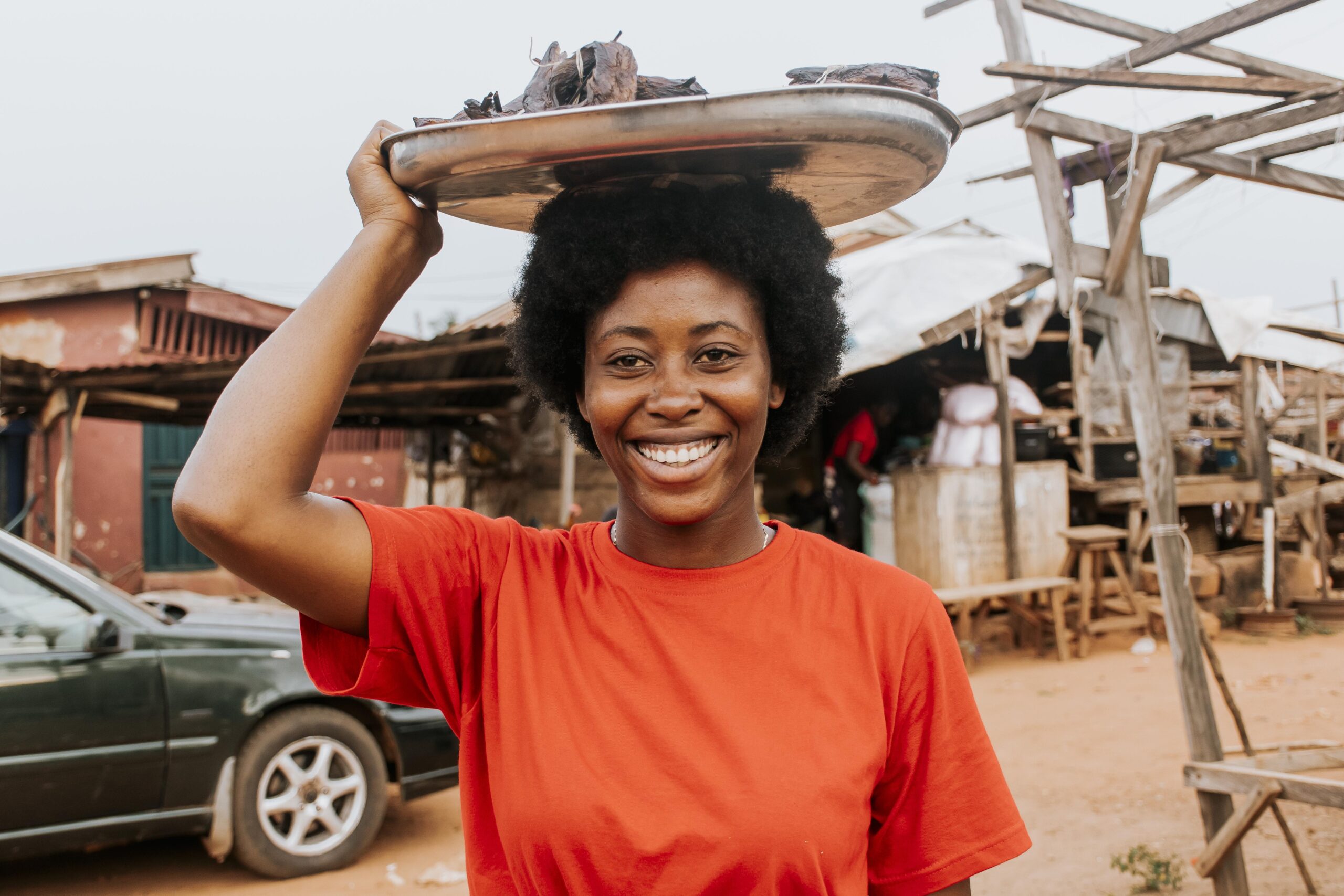 medium shot woman carrying food head